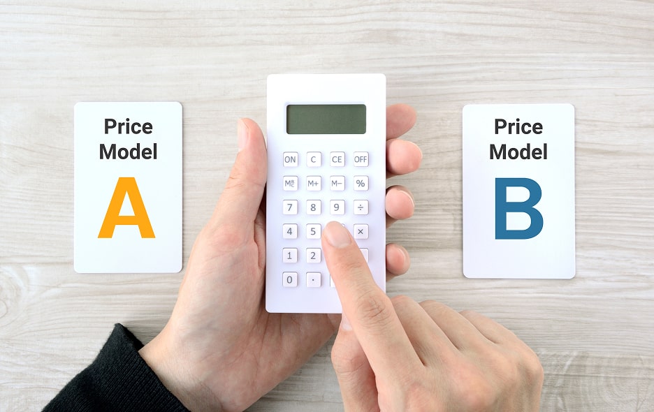 A man's hand uses a calculator to choose between two pricing models.