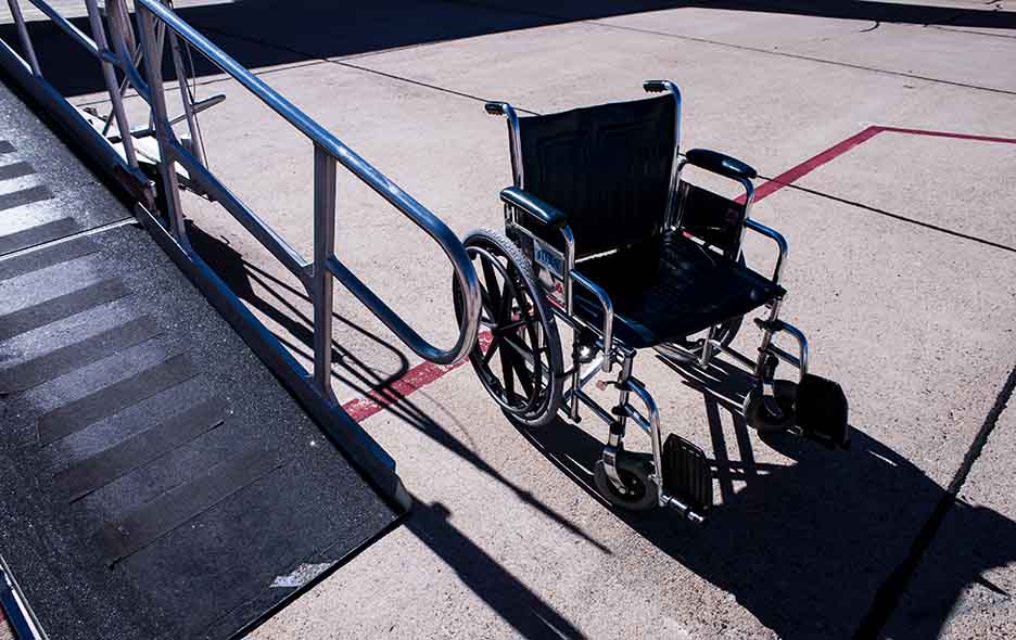 Wheelchair next to an access ramp