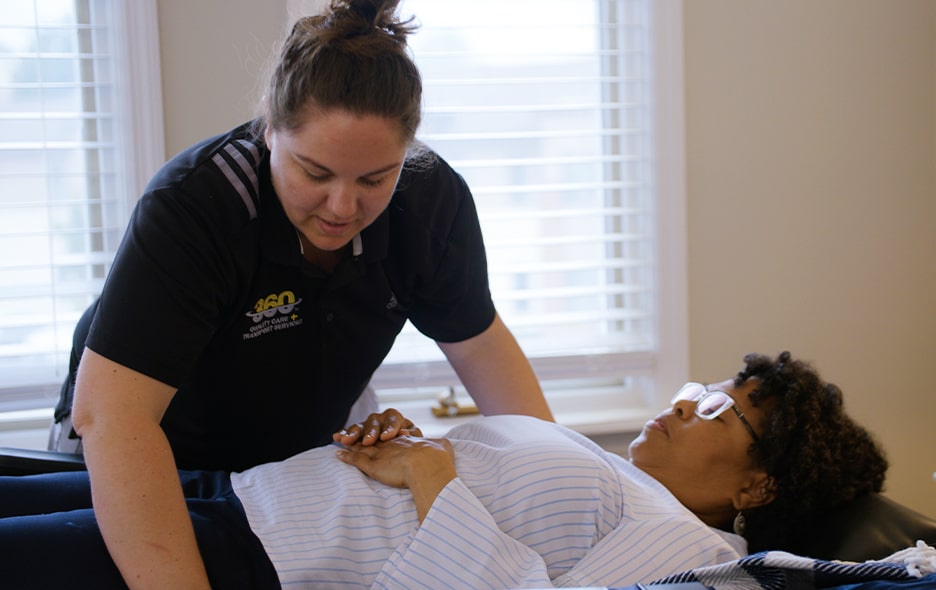 NEMT Operator helping situation a passenger