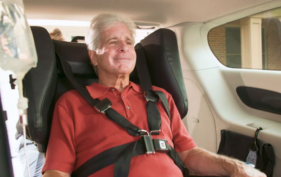 Man in Traversa Chair Inside a Van.