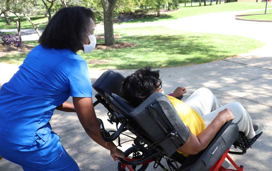 Nurse maneuvering a patient