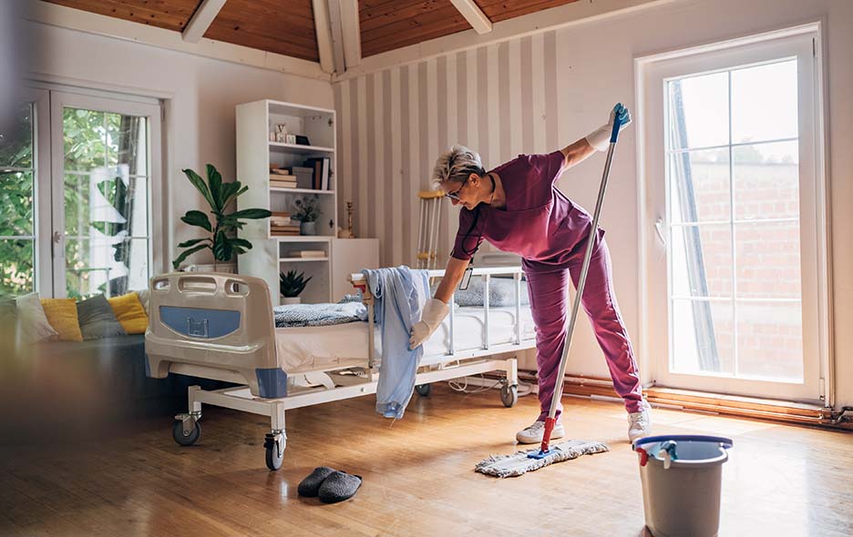Healtcare worker tidying a patient's room