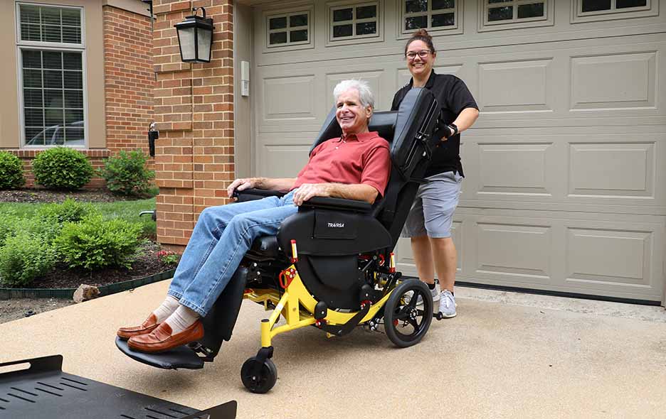 NEMT Operator smiling with a patient in a Traversa